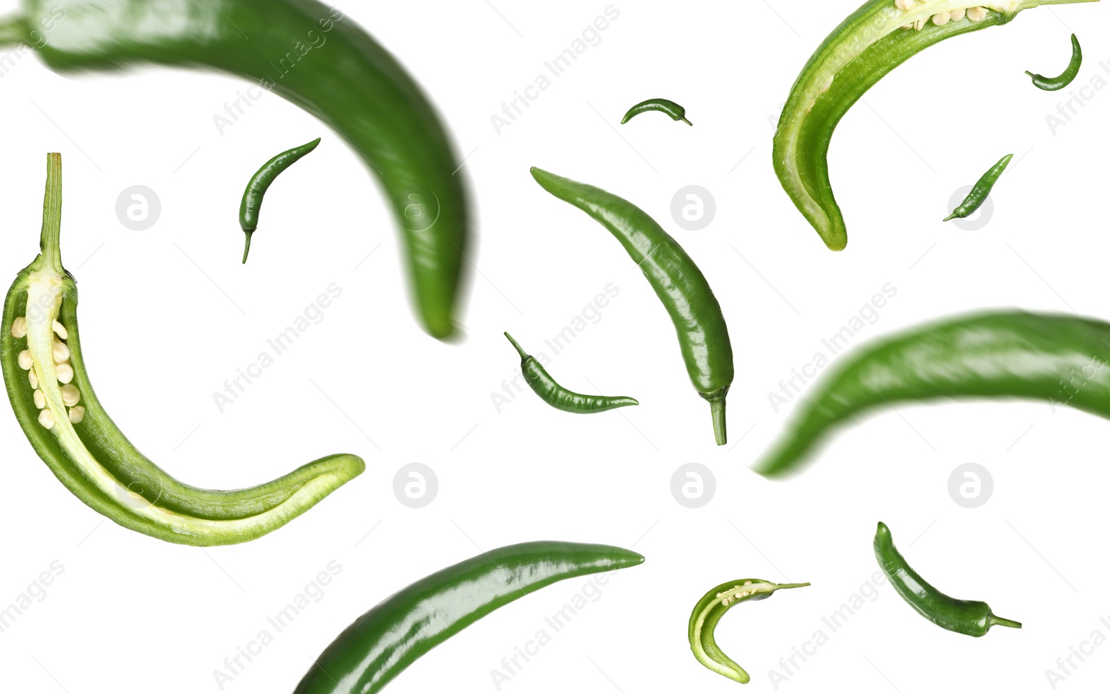 Image of Green chili peppers falling on white background 