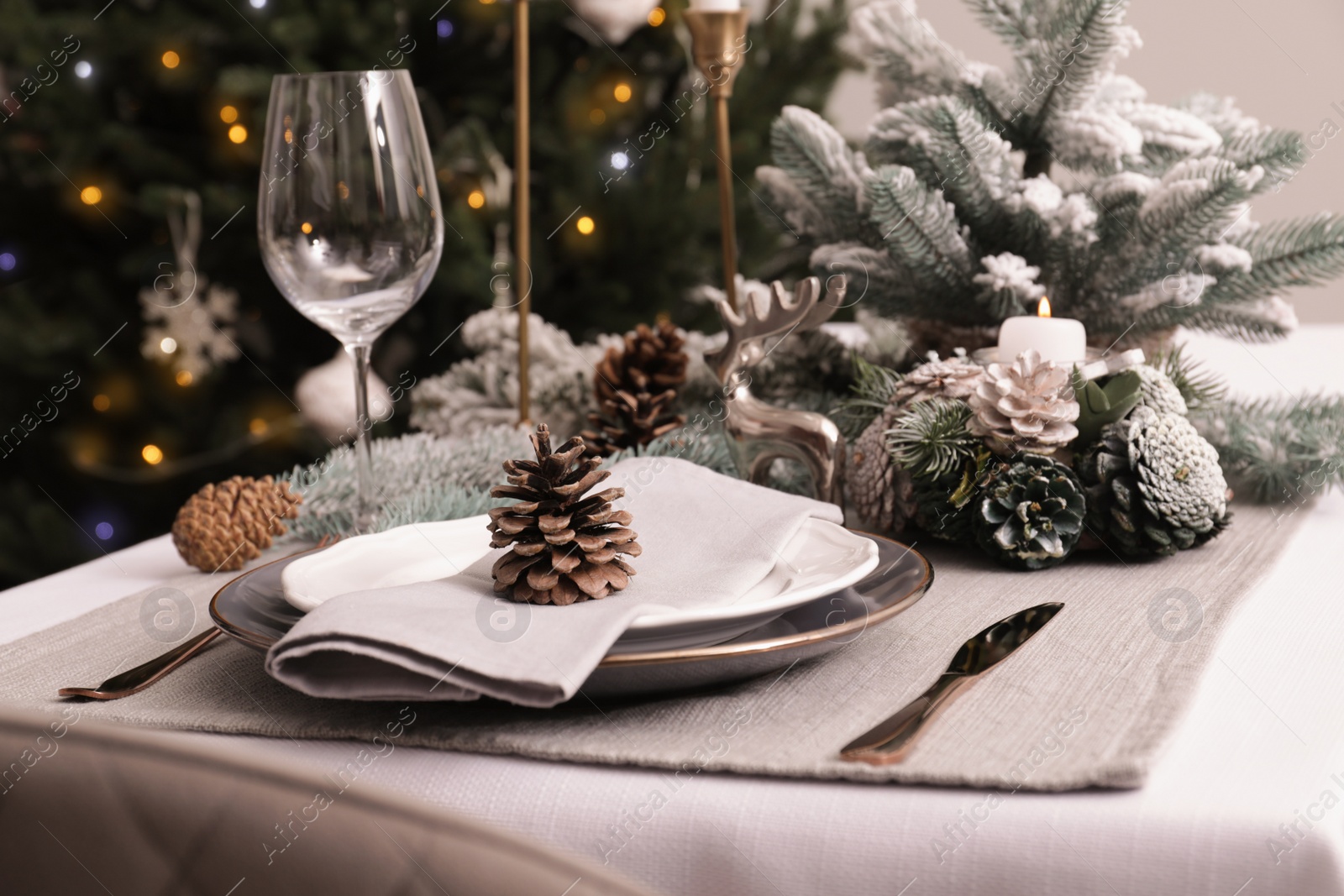 Photo of Luxury place setting with beautiful festive decor for Christmas dinner on white table