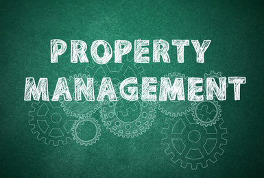 Text Property Management and gear images on green chalkboard