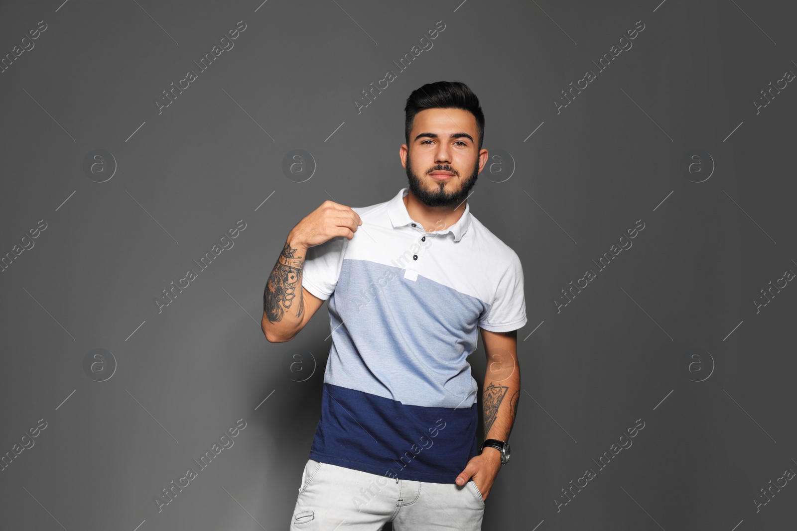 Photo of Portrait of handsome young man on gray background