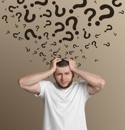 Image of Amnesia concept. Man trying to remember something on beige background. Flow of question marks symbolizing memory loss