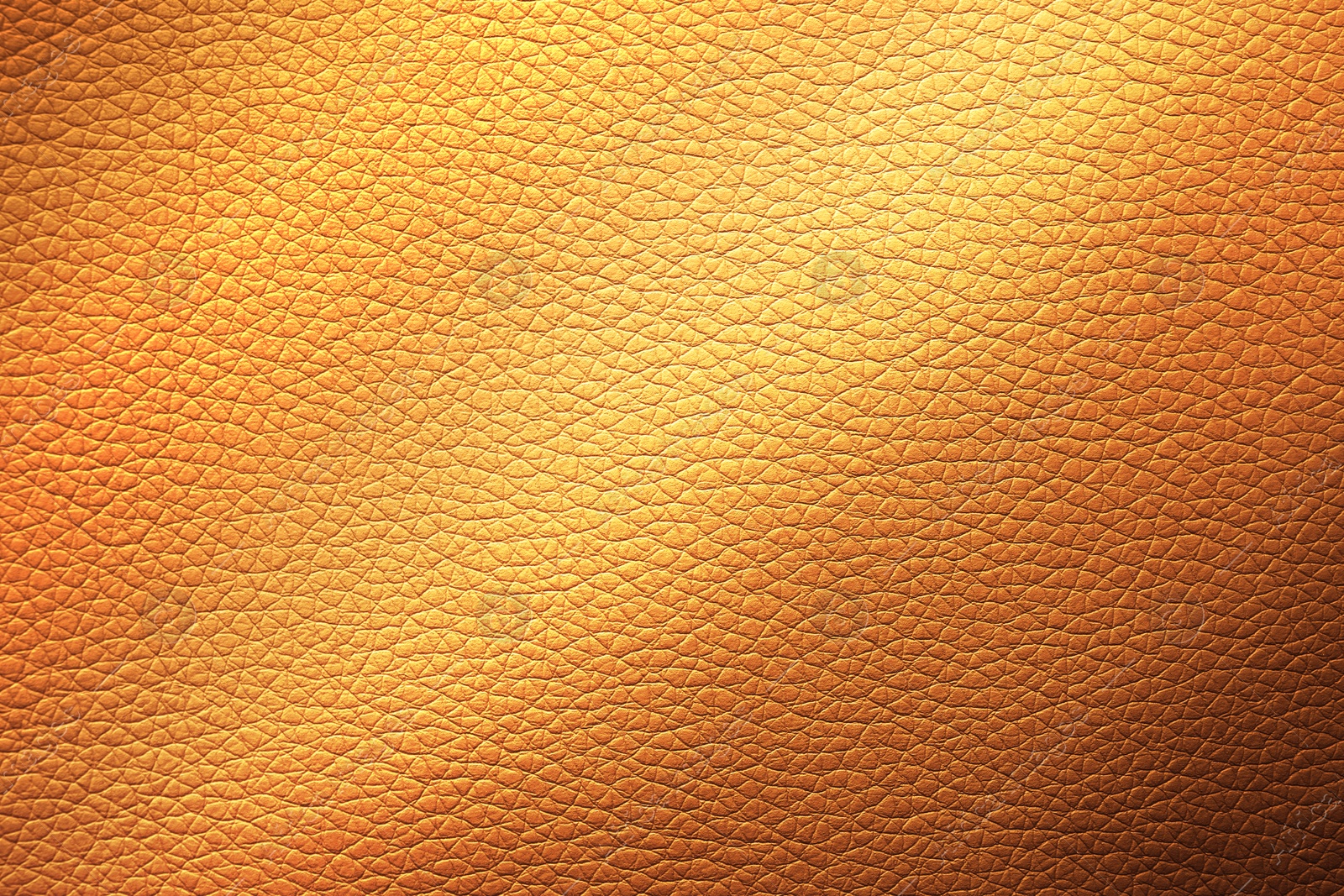 Image of Golden textured surface as background, closeup view