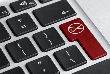 Image of Red button with sign No smoking on computer keyboard, closeup