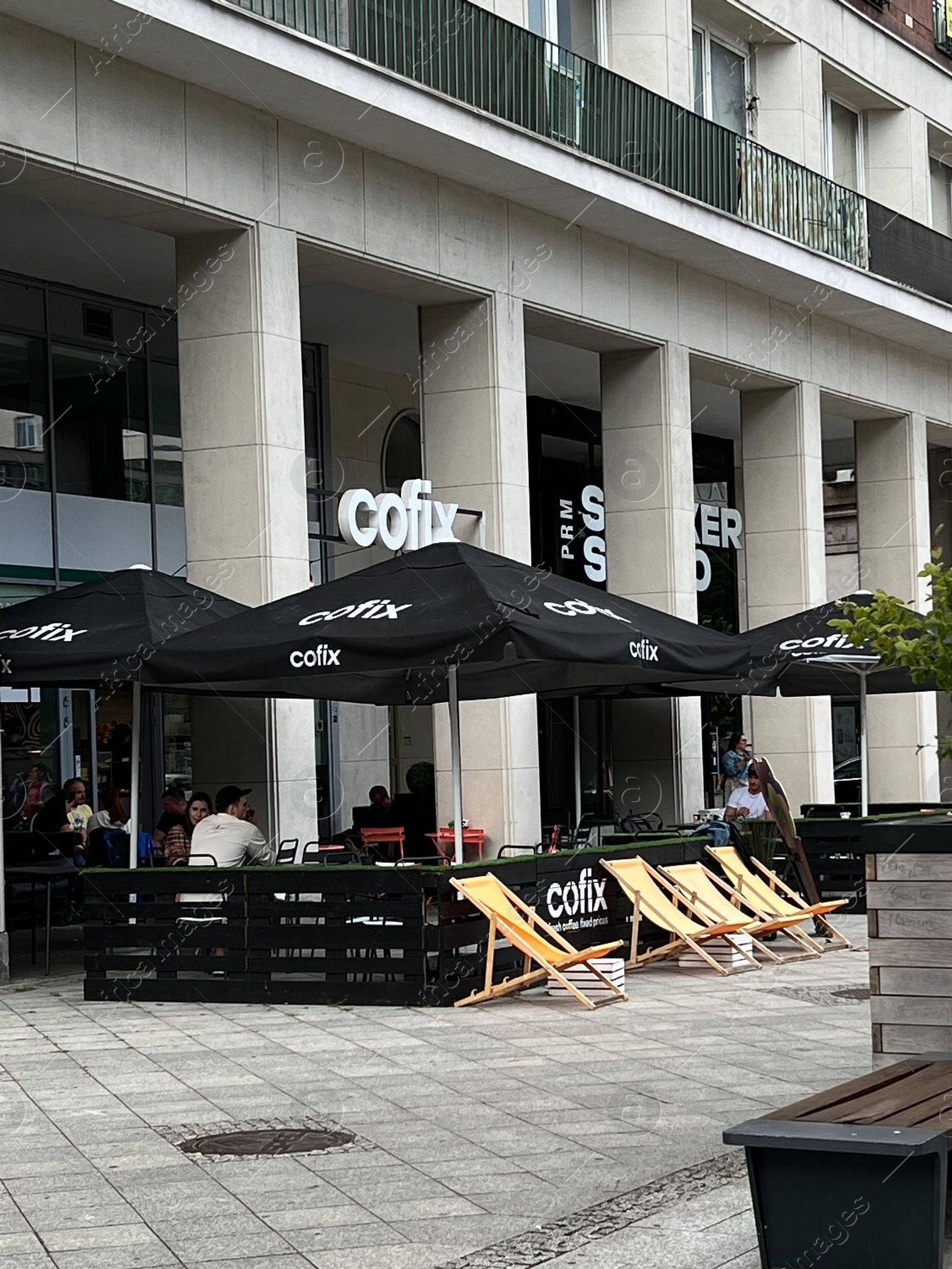 Photo of WARSAW, POLAND - JULY 17, 2022: Beautiful view of modern cafe with outdoor terrace