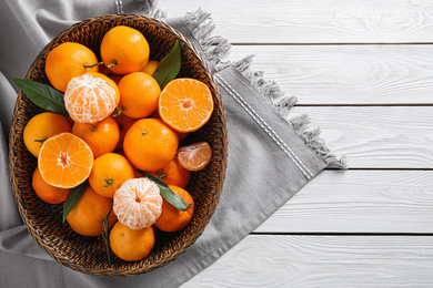 Fresh ripe tangerines on white wooden table, top view