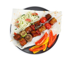 Photo of Delicious shish kebabs with vegetables isolated on white, top view