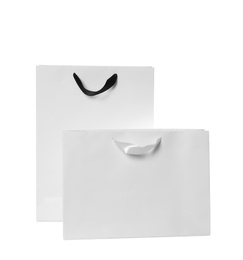 Photo of Paper shopping bags isolated on white. Mock up for design