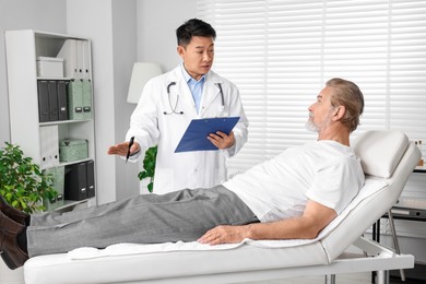 Photo of Senior patient having appointment with doctor in clinic