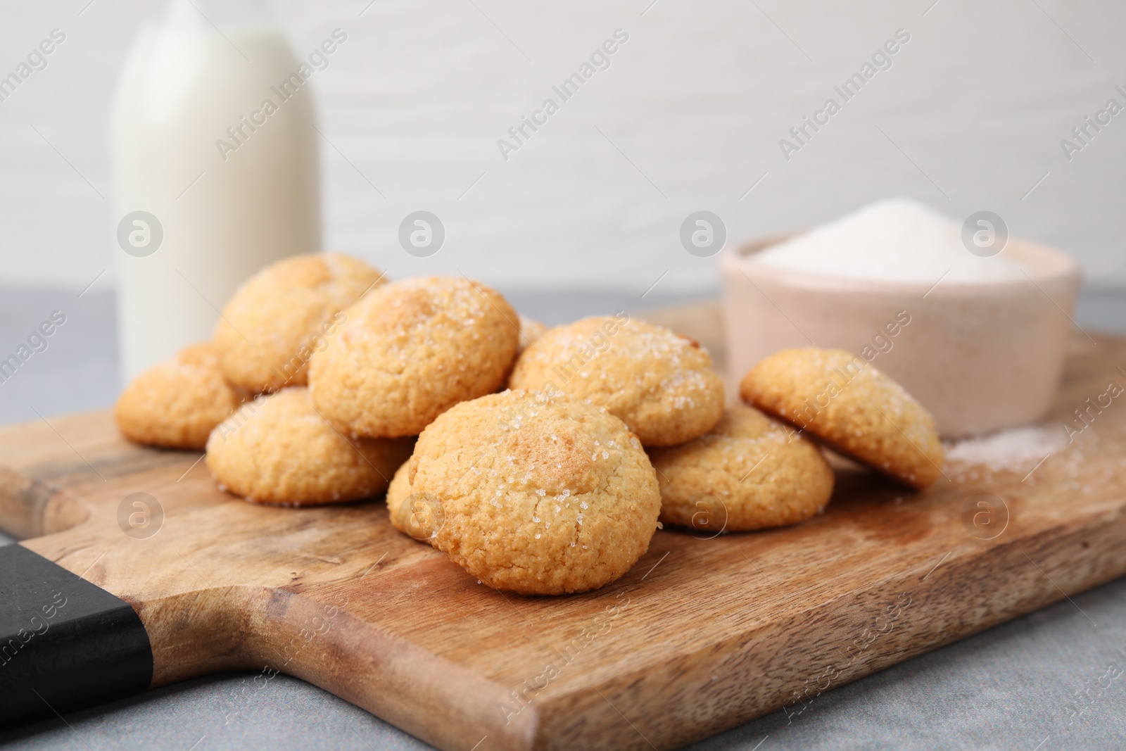 Photo of Tasty fresh sugar cookies on grey table, closeup