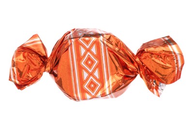 Candy in orange wrapper isolated on white