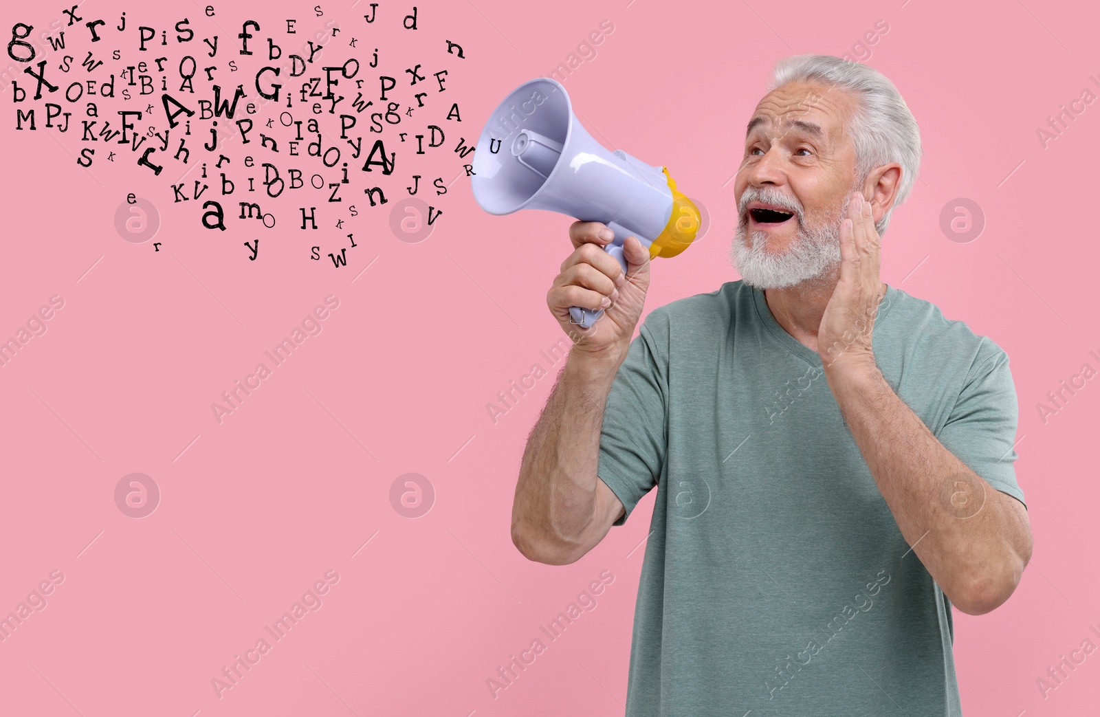 Image of Man using megaphone on pink background. Letters flying out of device