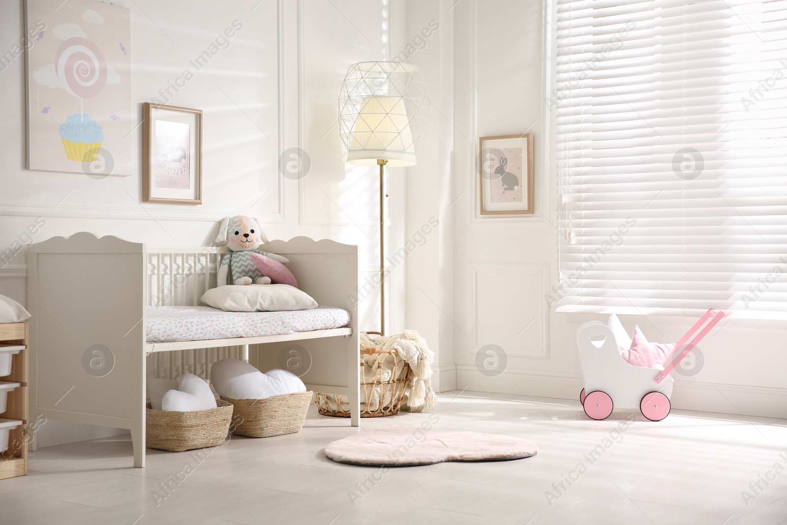 Photo of Baby room interior with stylish furniture and toys