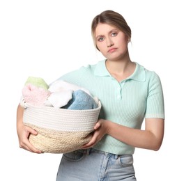 Photo of Sad woman with basket full of laundry on white background