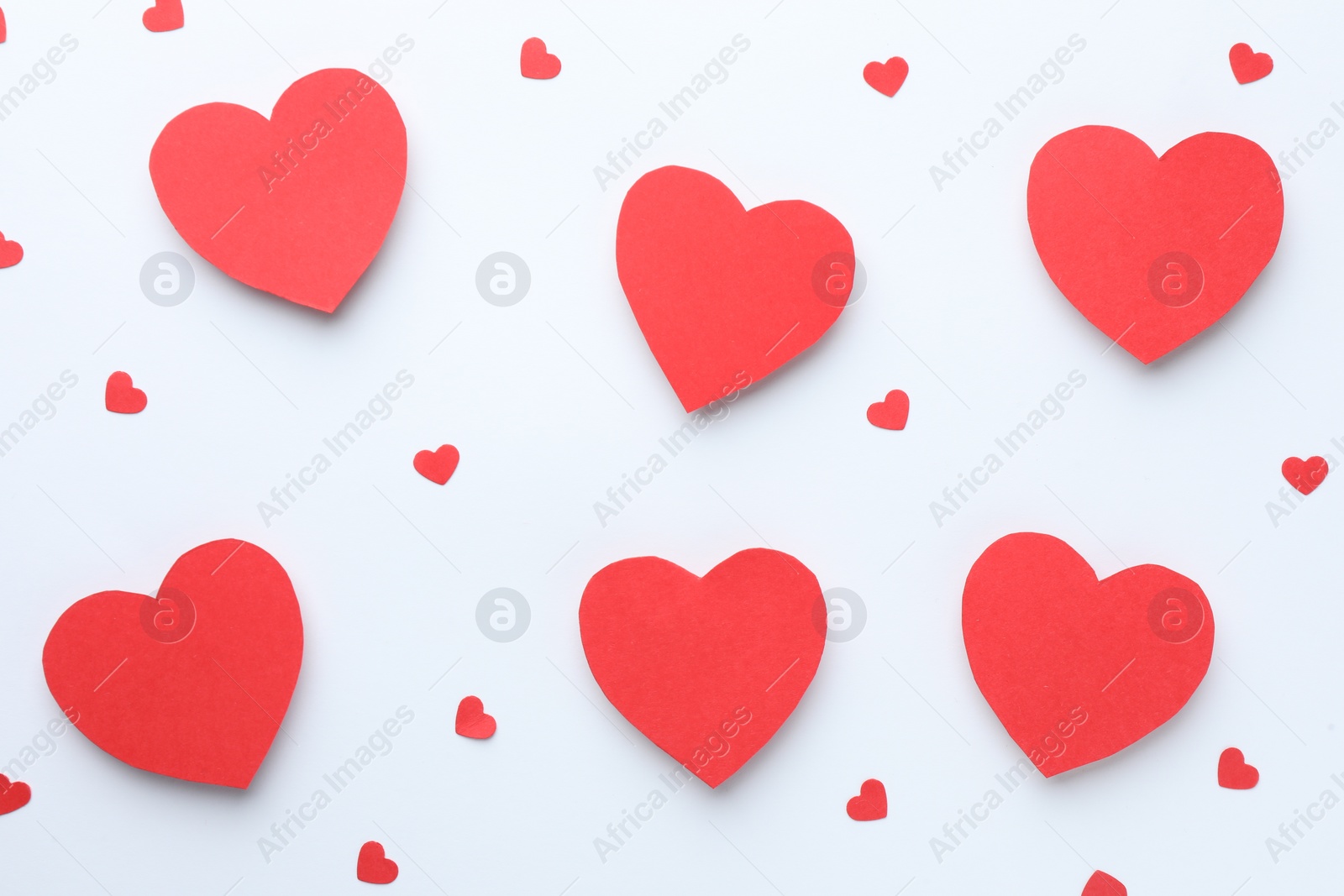 Photo of Paper hearts on white background, flat lay