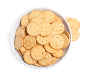 Tasty crackers in bowl isolated on white, top view