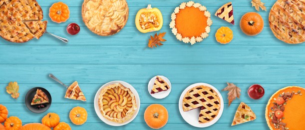 Image of Flat lay composition with different tasty pies on blue wooden table. Banner design