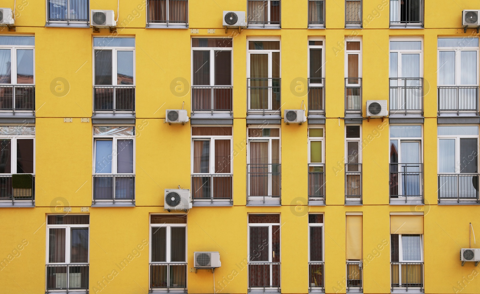 Photo of Colorful modern building with windows. Urban architecture