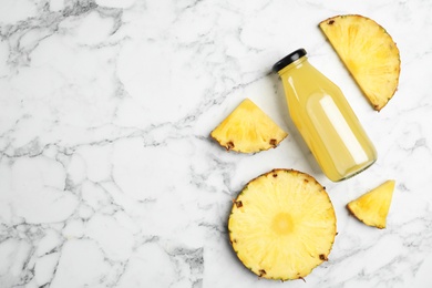 Photo of Delicious pineapple juice and fresh fruit on white marble table, flat lay. Space for text