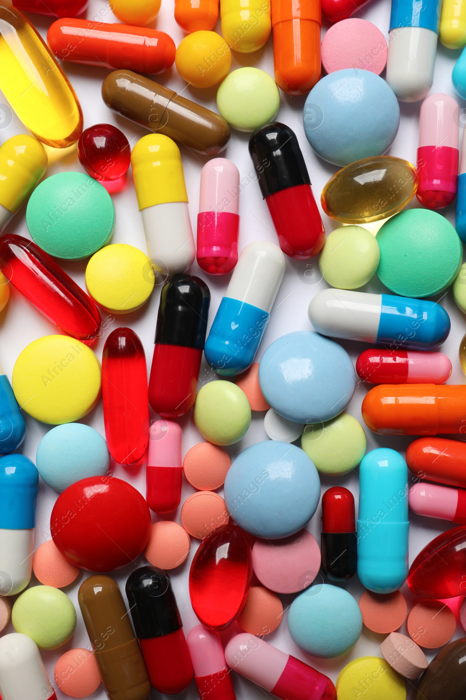 Photo of Lots of different colorful pills as background, top view