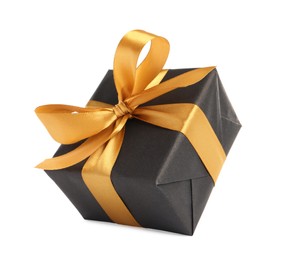 Beautiful gift box with golden ribbon and bow on white background