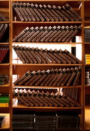 Collection of different books on shelves in library