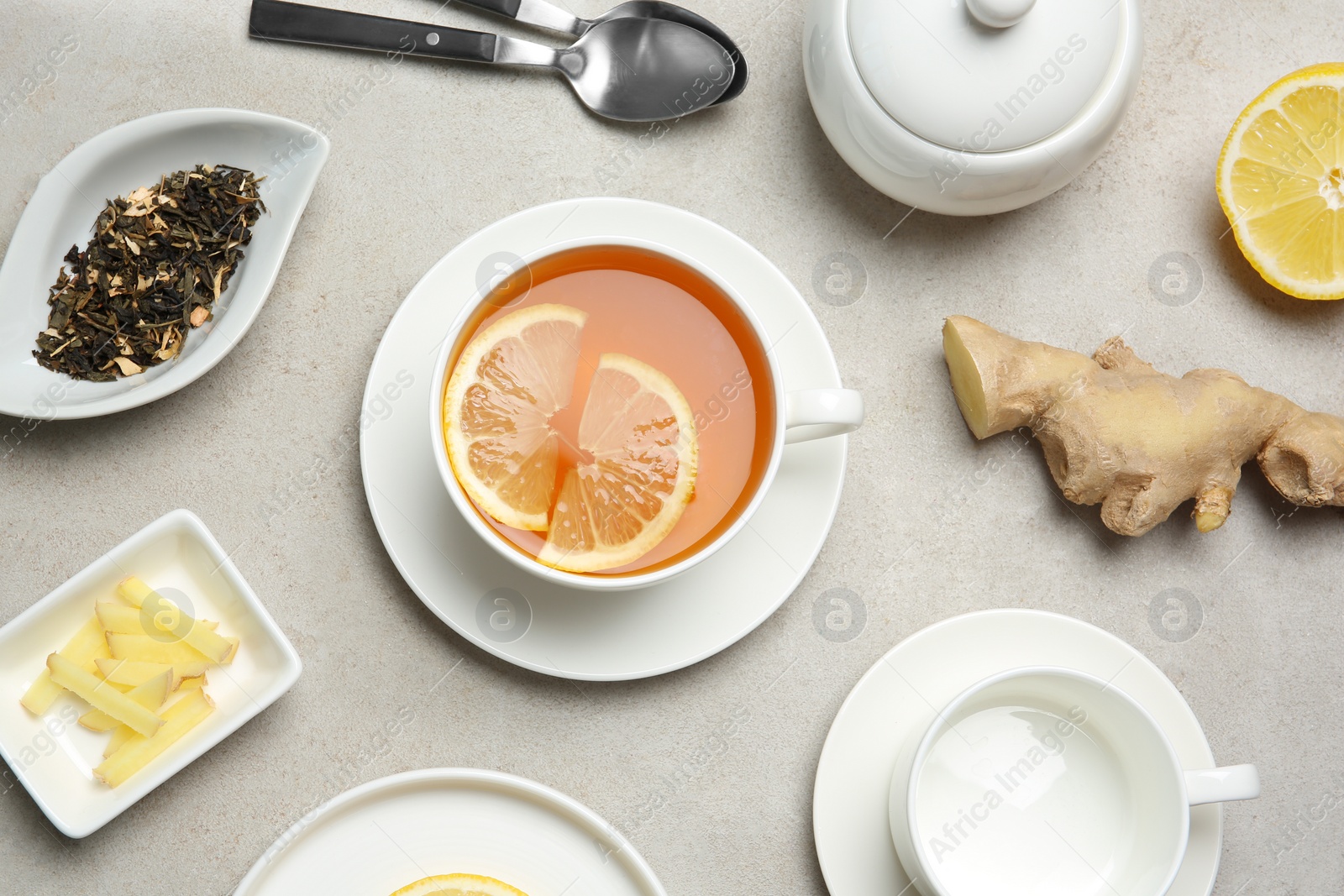 Photo of Composition with lemon tea on color background, top view