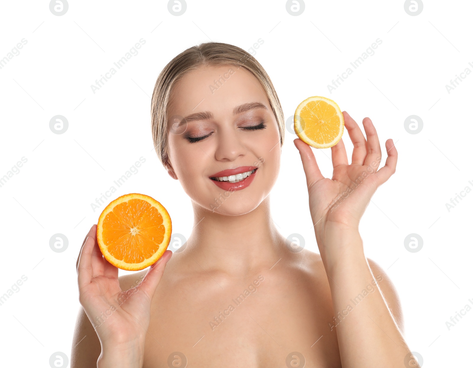 Photo of Young woman with cut orange and lemon on white background. Vitamin rich food