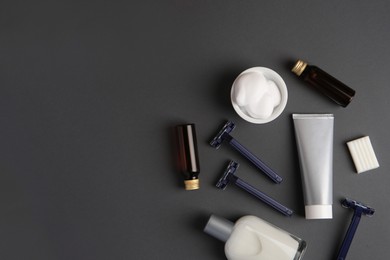 Flat lay composition with shaving accessories for men on grey background. Space for text