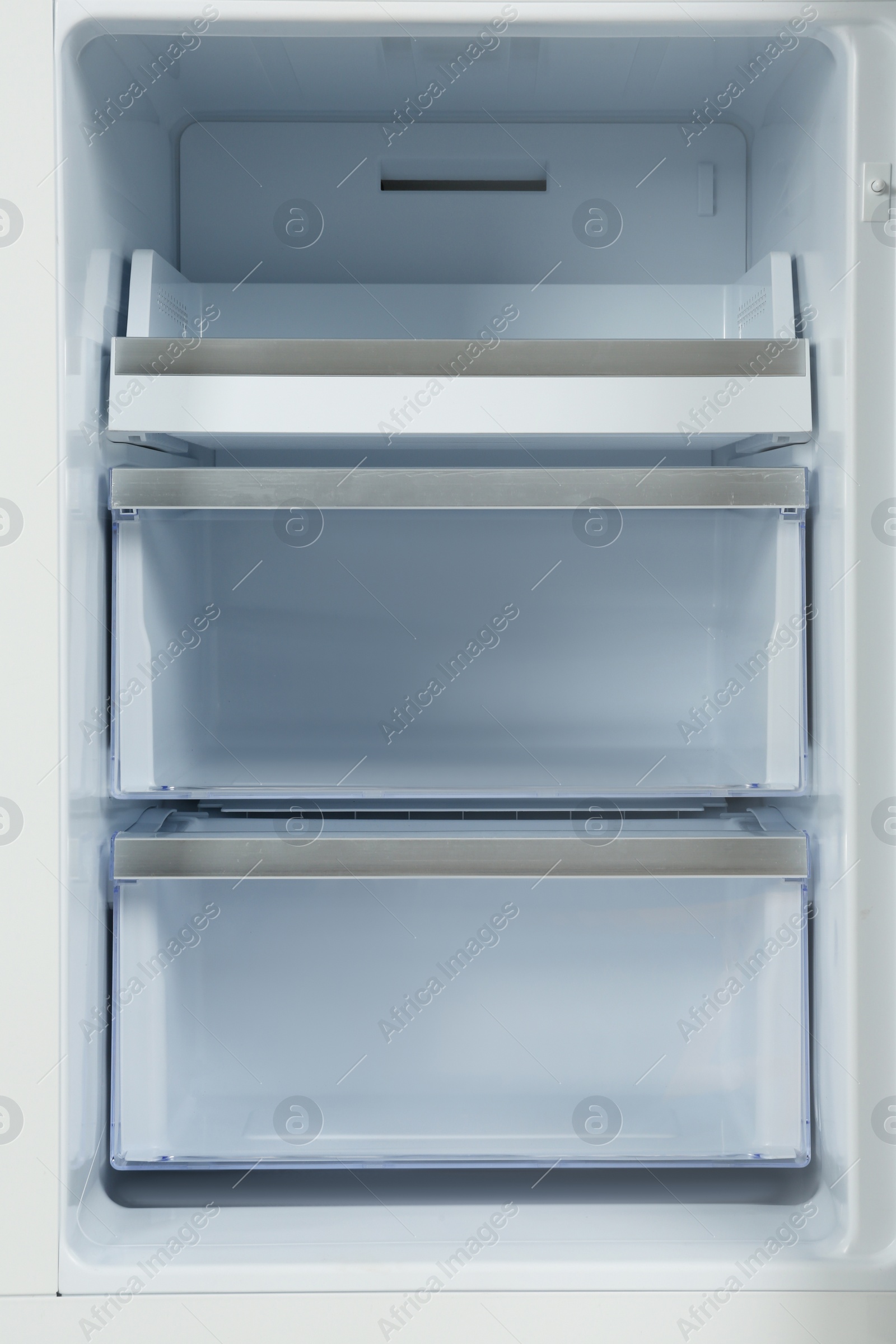 Photo of Shelves of empty modern refrigerator, closeup view