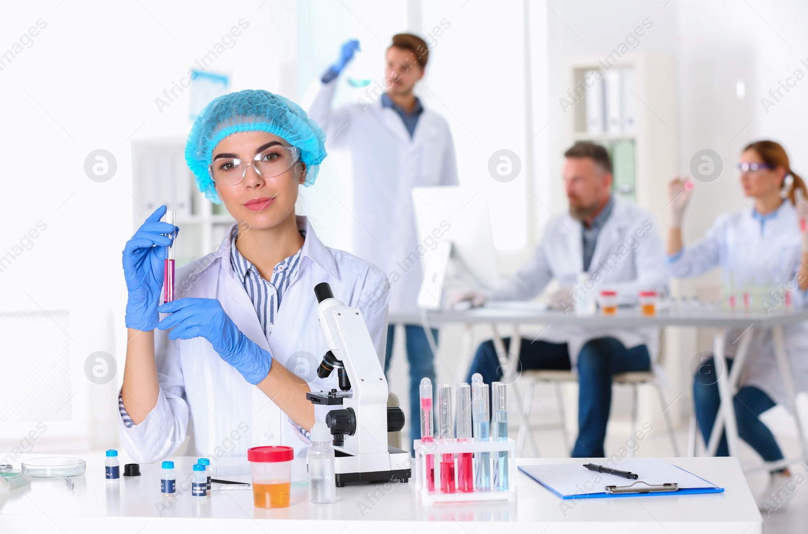 Photo of Portrait of female scientist working at table in laboratory, space for text. Research and analysis