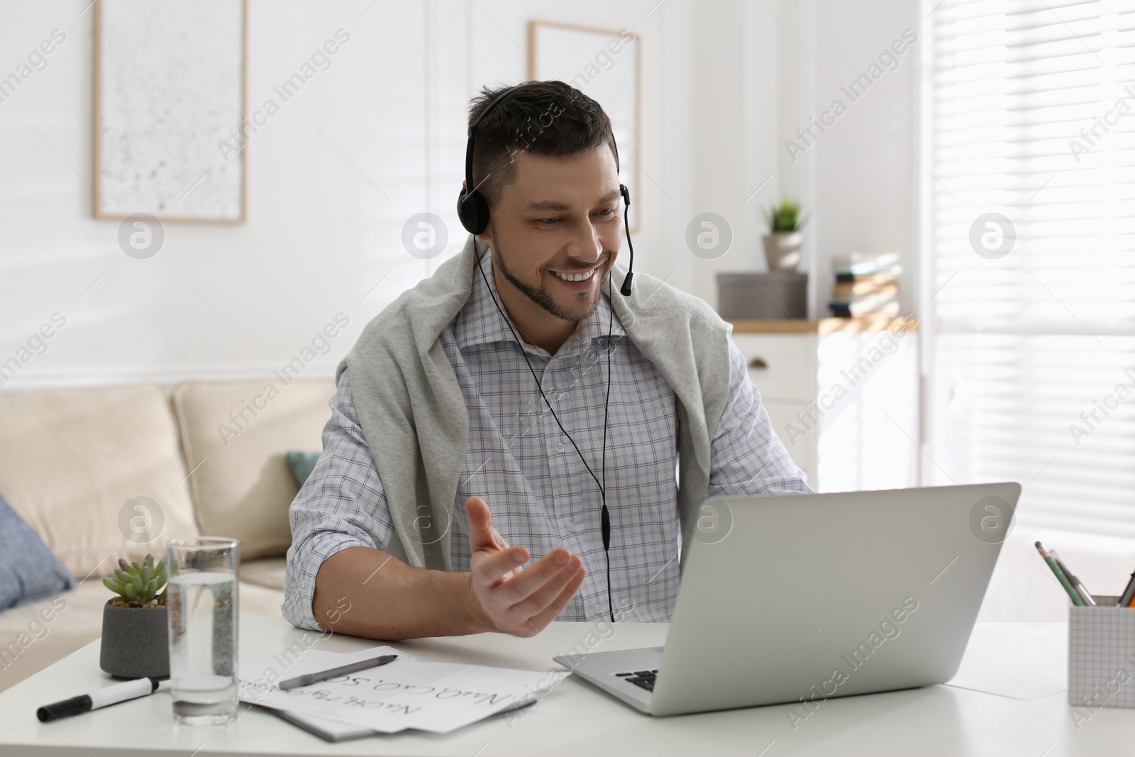 Photo of Teacher conducting online lesson at home during COVID-19 quarantine