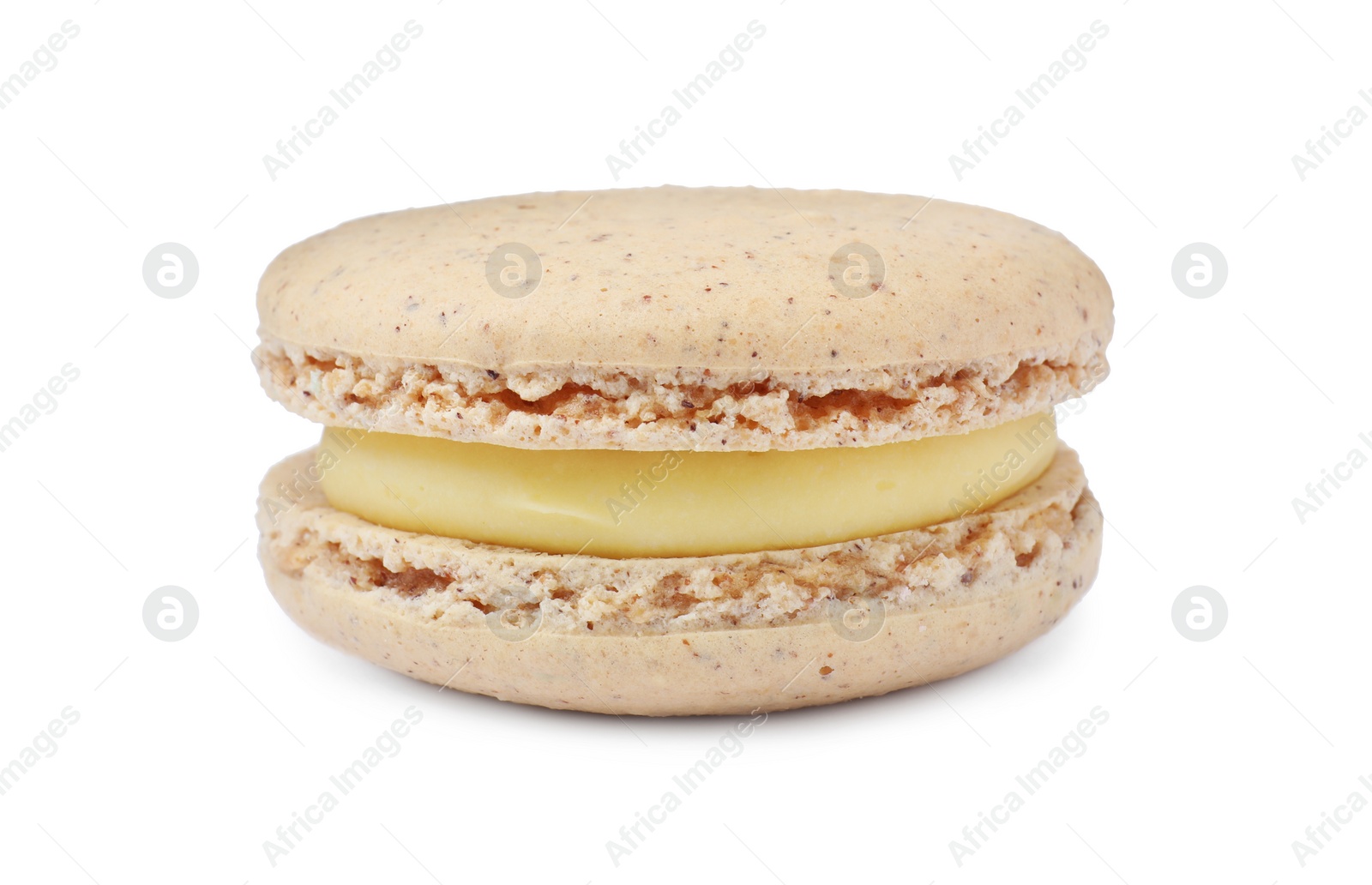 Photo of Beige macaron isolated on white. Delicious dessert