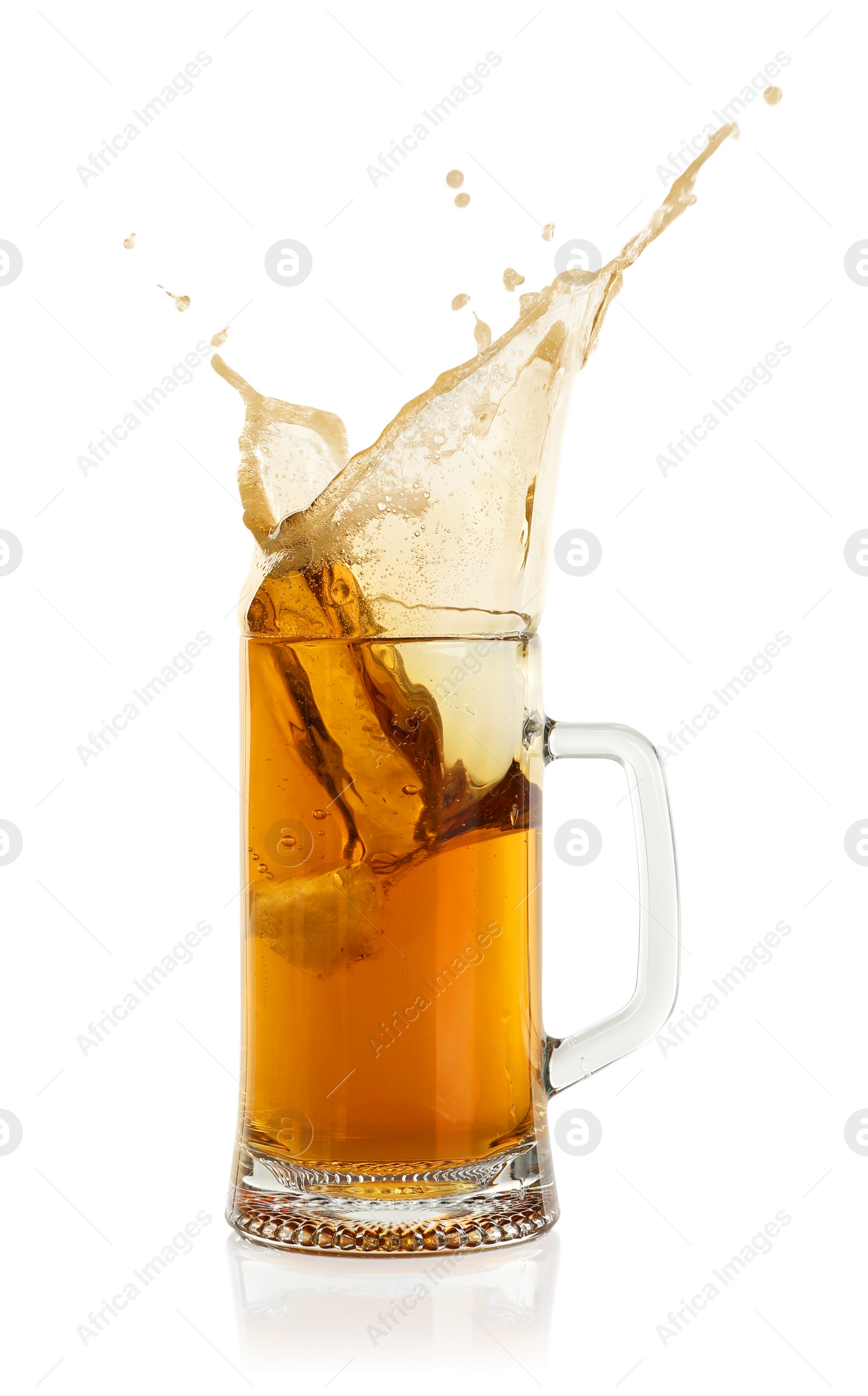 Photo of Beer splashing out of glass on white background