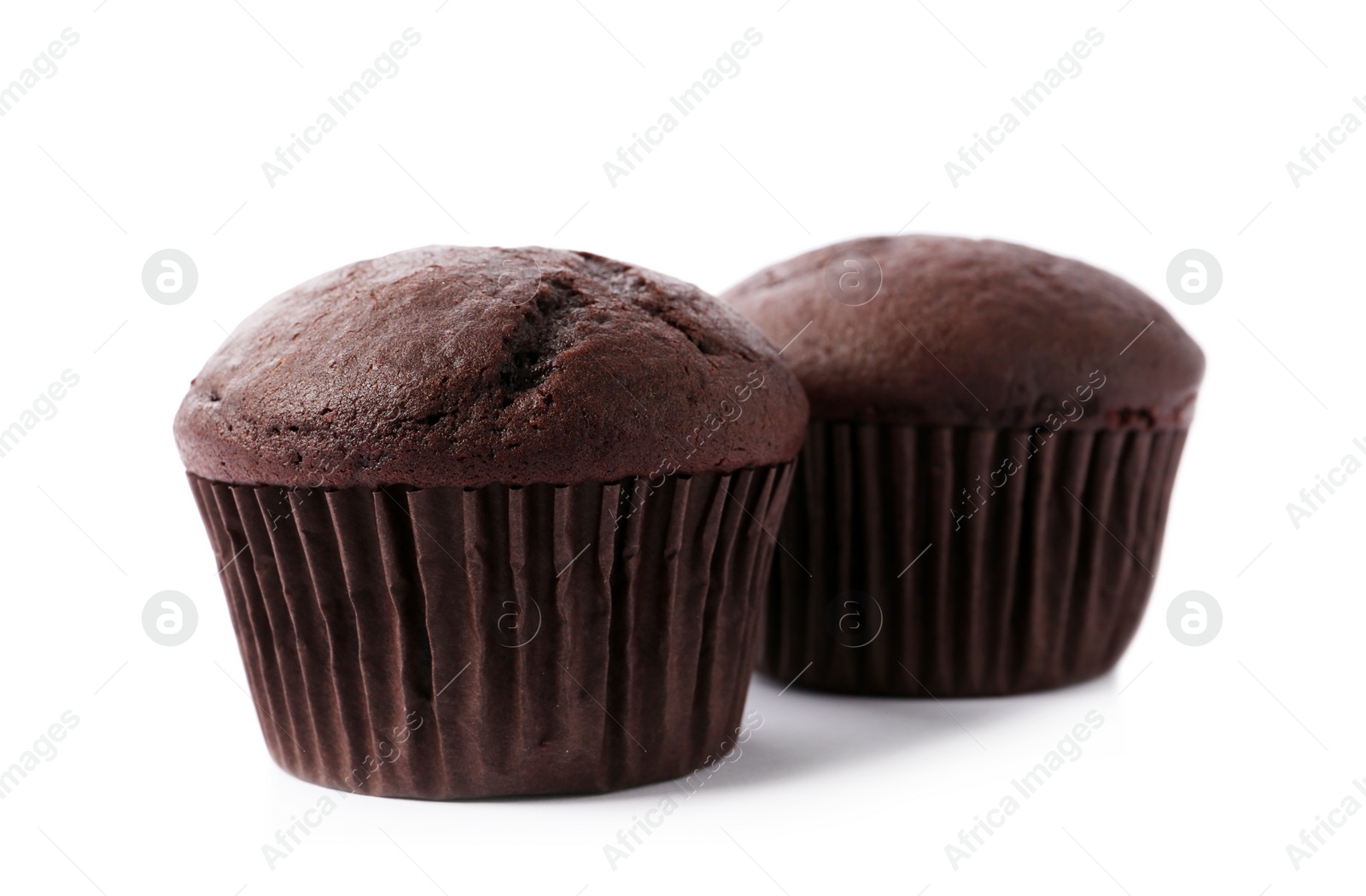 Photo of Delicious fresh chocolate cupcakes isolated on white