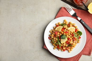 Photo of Delicious fresh chickpea salad on light grey table, flat lay. Space for text