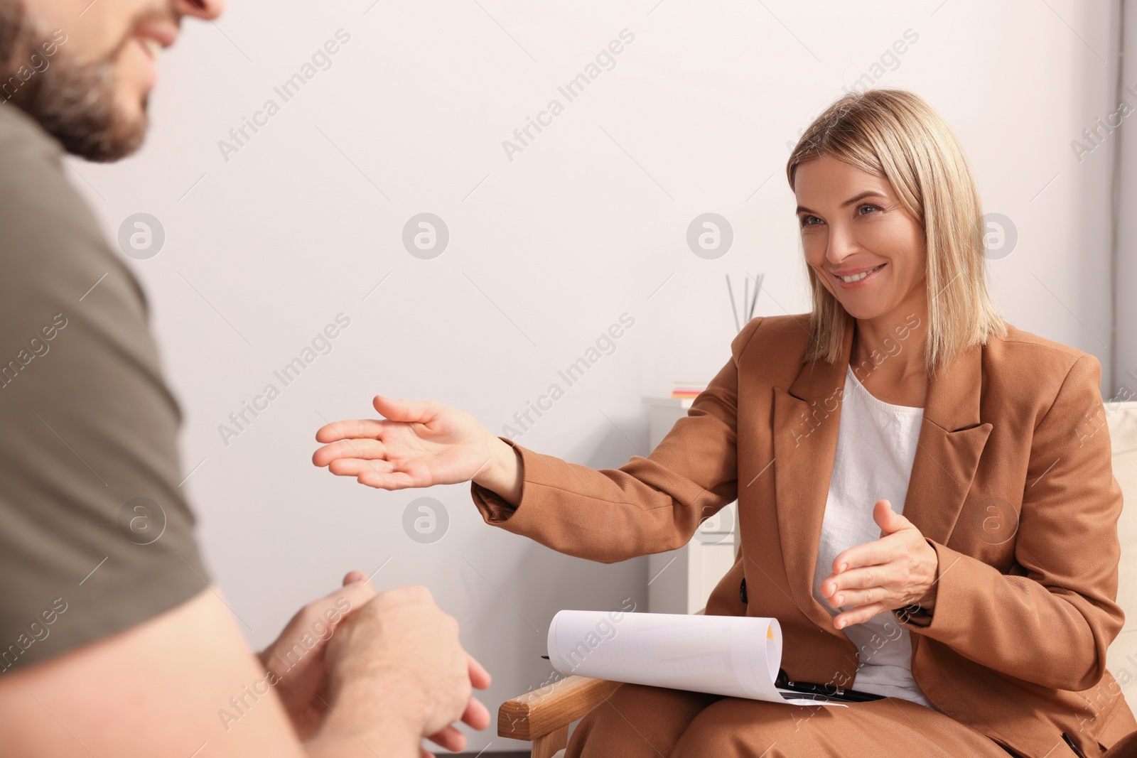 Photo of Psychologist working with military officer in office