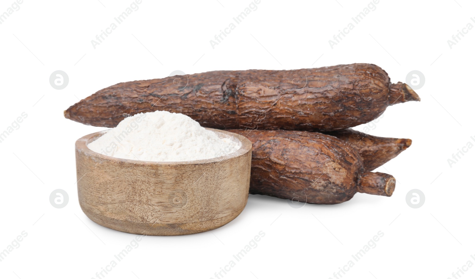 Photo of Bowl with cassava flour and roots isolated on white