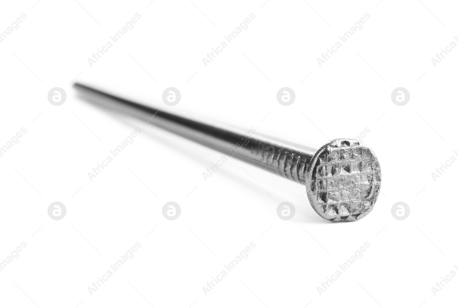 Photo of One shiny metal nail isolated on white