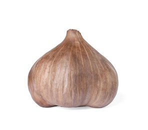 Photo of Unpeeled bulb of black garlic on white background