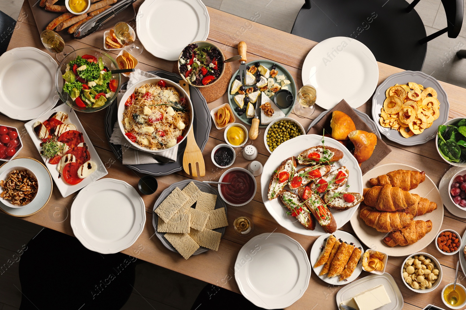 Photo of Brunch table setting with different delicious food indoors, top view