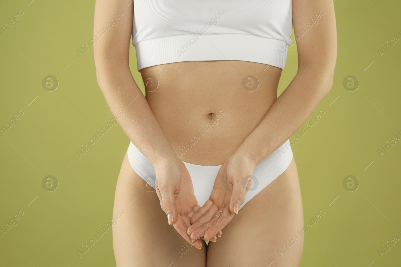 Photo of Gynecology. Woman in underwear on green background, closeup