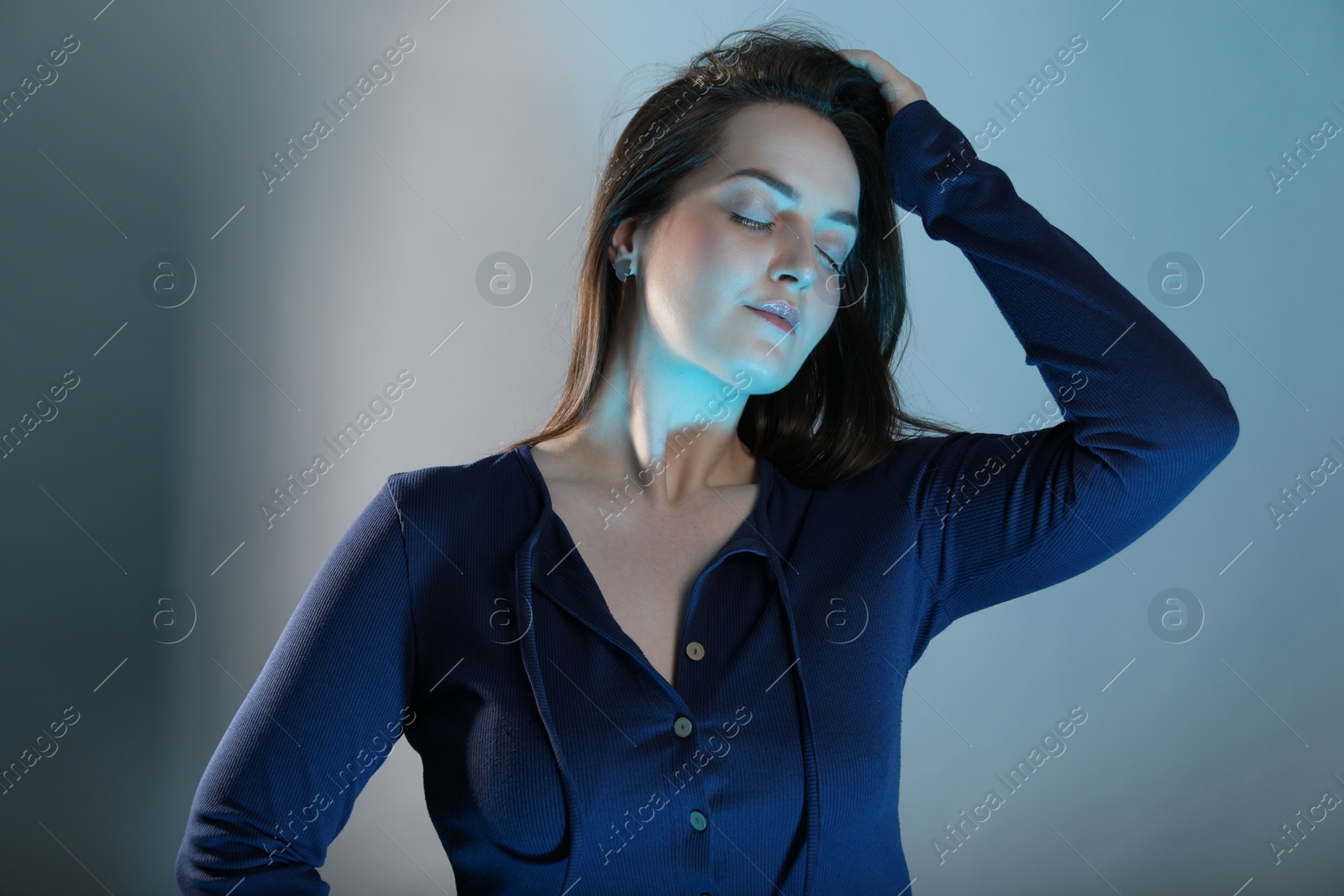 Photo of Portrait of beautiful woman on color background