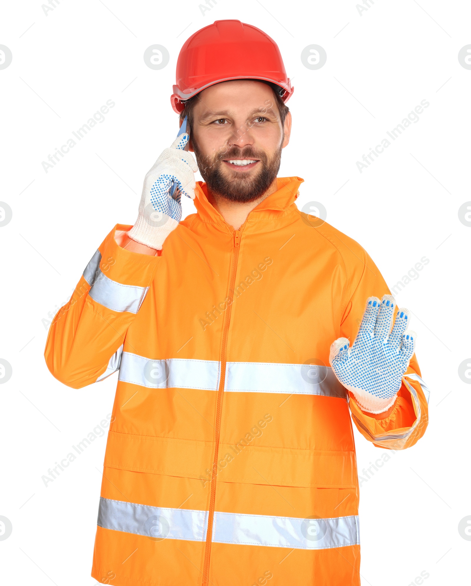 Photo of Man in reflective uniform talking on smartphone against white background