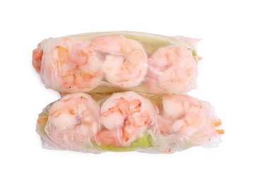 Tasty spring rolls on white background, top view