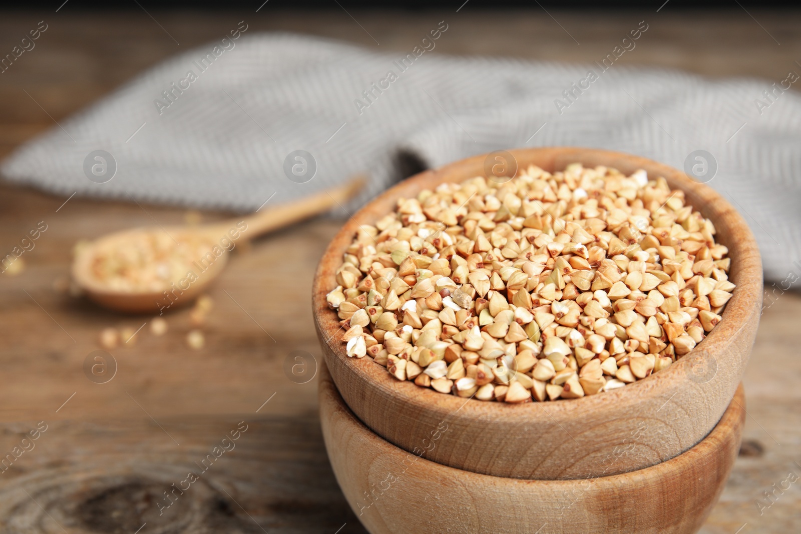 Photo of Organic green buckwheat on table, closeup. Healthy food