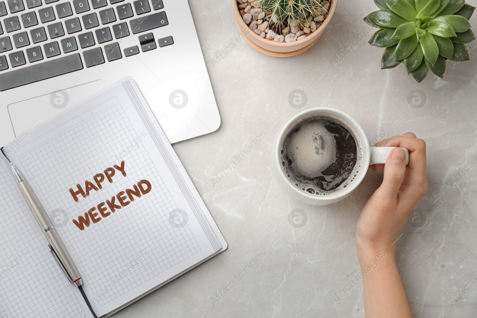 Image of Happy Weekend. Young woman with cup of delicious hot coffee at light grey marble table, top view