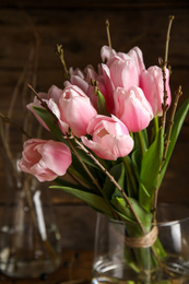 Photo of Beautiful bouquet of spring pink tulips on blurred background