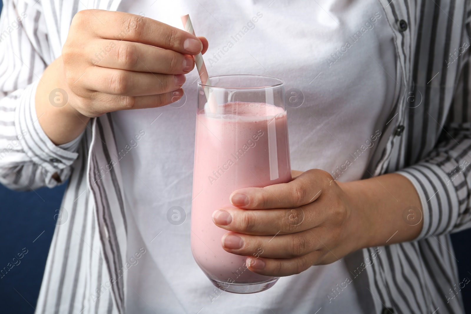 Image of Woman with glass of tasty smoothie, closeup