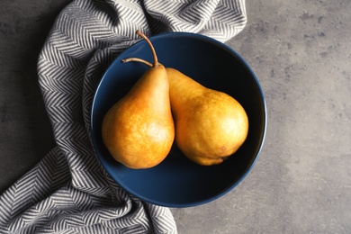 Photo of Flat lay composition with ripe pears on grey background