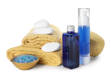 Photo of Spa composition. Bottles of cosmetic products, towels, stones and sea salt isolated on white